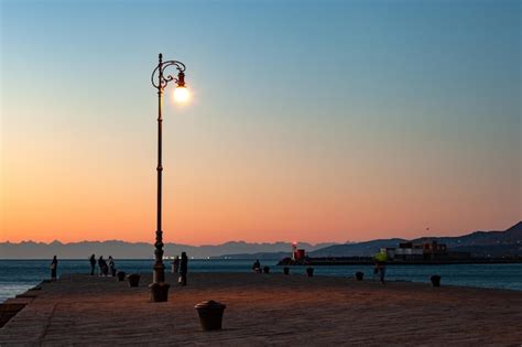 Premium Photo | View of the illuminated street lantern in the molo ...