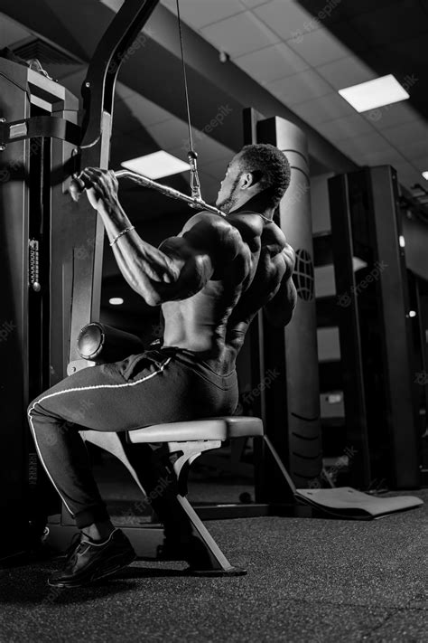 Premium Photo | Black bodybuilder having workout on modern sport