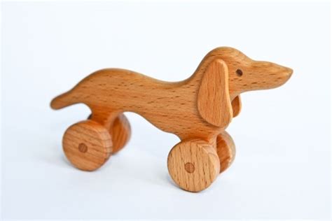 Игрушка из дерева, каталка такса на колесиках