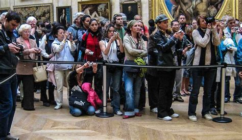 Tourists Photographing the Mona Lisa - Travel Past 50