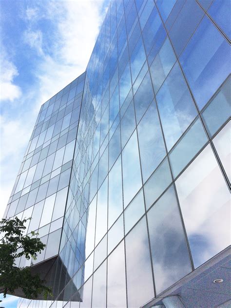 Aqua and Coral Imagery: Sky and Clouds Skyscraper Glass Reflections