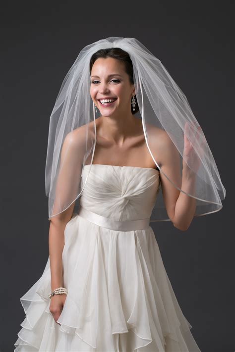 A two tier waist length veil with a pencil ribbon edge. "HALO" | Toni
