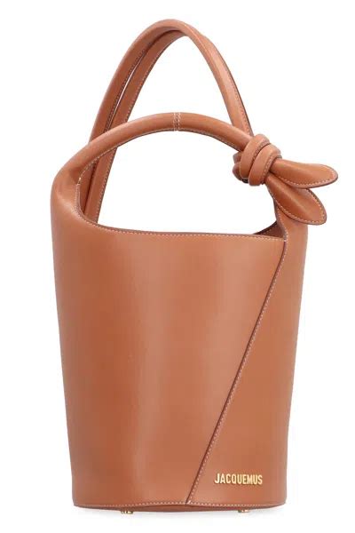 jacquemus logo plaque knot detailed top handle bag  brown modesens