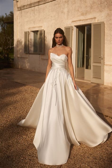 Luxury Satin Strapless Wedding Gown with Beaded Corset and Majestic Tr