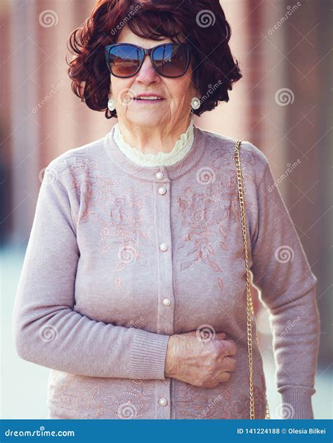 Portrait of Beautiful, Fashionable Mature Woman 80 Years Old Walking on