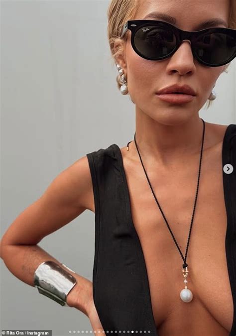 rita ora sets pulses racing   poses topless  sizzling selfie