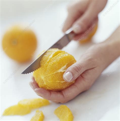 cutting  orange stock image  science photo library