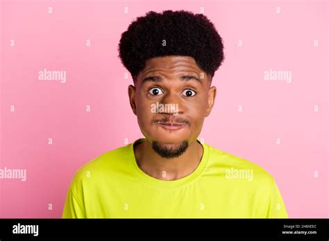 photo  young african guy hold breath air pouted cheeks fooling