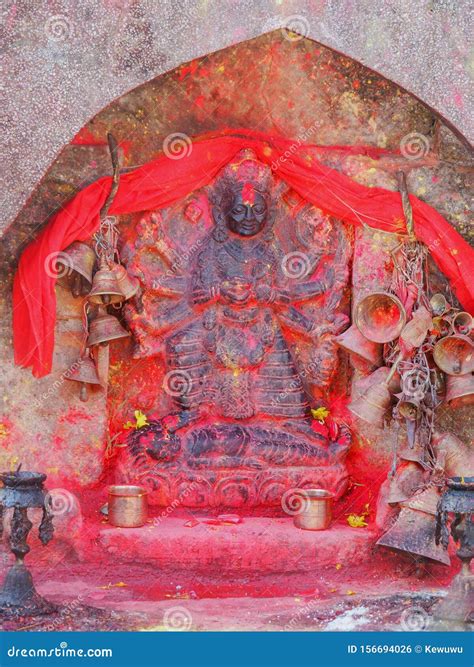 Metal Bells Offered By Devotees At Kali Temple. Shrine Full Of Red