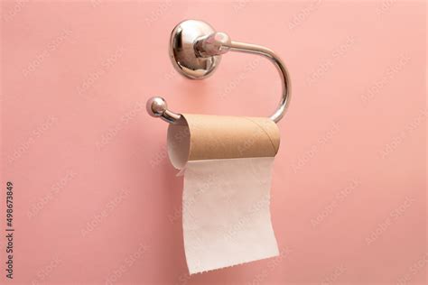 Empty toilet paper roll. The last sheet of toilet paper. Pink ...