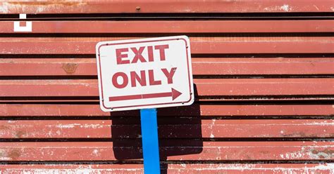 red  white exit  sign   blue pole photo  exit image