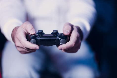 premium photo guy young adult man playing video game  game console
