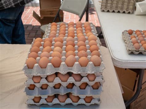 Crate of Organic Brown Eggs Sitting on Table for Sale at a Market Stock ...