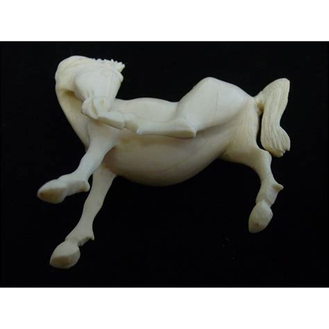 2 ivory figurines of a "Horse" & "Elephant"