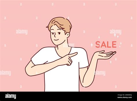 Positive man pointing finger at inscription sale, inviting for