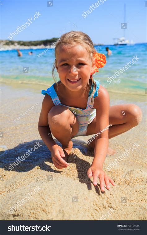 Little Girl Playing On Sand Beach Stock Photo 768101515 | Shutterstock