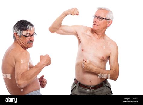 happy naked senior men comparing muscles isolated  white