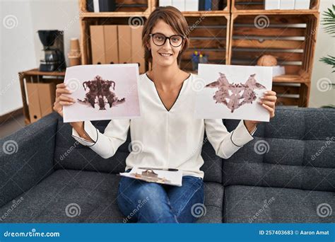 Brunette Woman Working with Rorschach Test at Psychology Clinic Smiling ...
