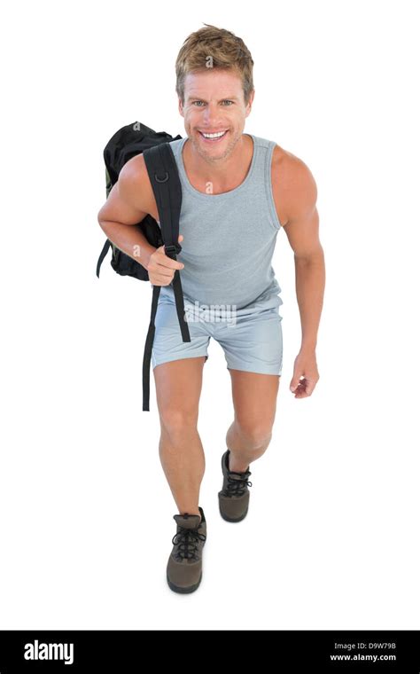 cheerful man holding backpack stock photo alamy