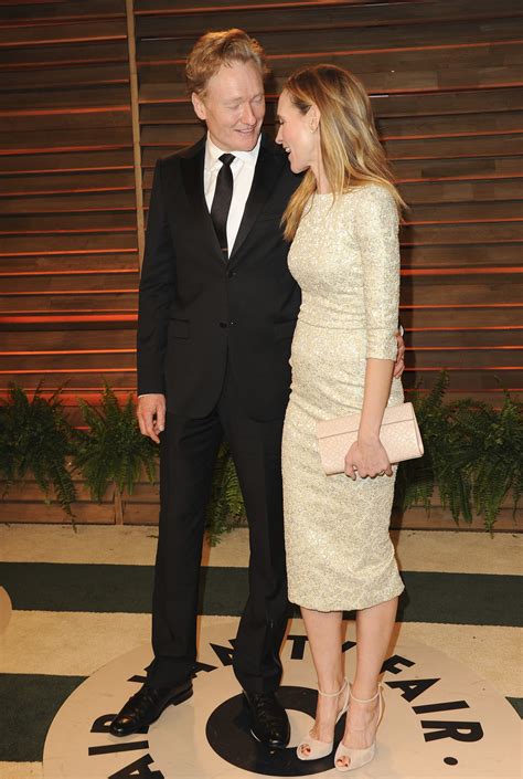 Conan O'Brien and his wife, Liza Powel, shared a moment. | Couples Get