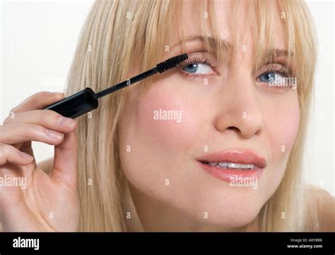 woman applying mascara stock photo alamy