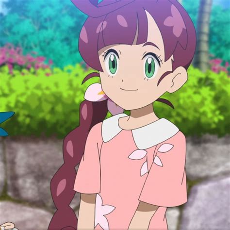 an anime character with long hair and green eyes standing in front of ...