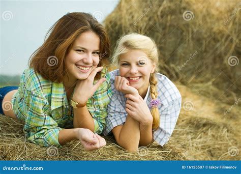 Pretty girls on hay stock image. Image of complexion - 16125507