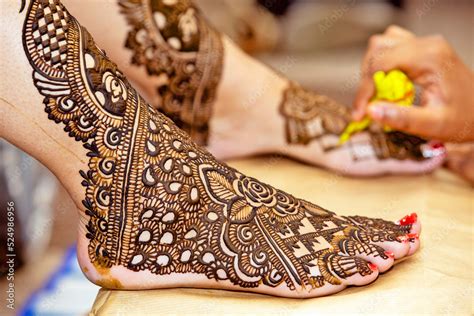 henna design on Bride's feet on her wedding eve. Stock Photo | Adobe Stock