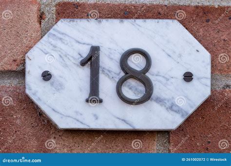 Marble Plate with Number 18 on a Red Concrete Wall Stock Photo - Image ...