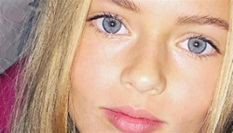 a girl with blue eyes and blonde hair is looking at the camera while ...