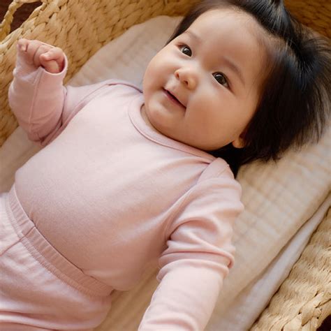 merino kids merino long sleeve envelope bodysuit cloud pink