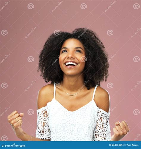 My Luck Has Finally Changed. a Beautiful Young Woman Cheering Against a