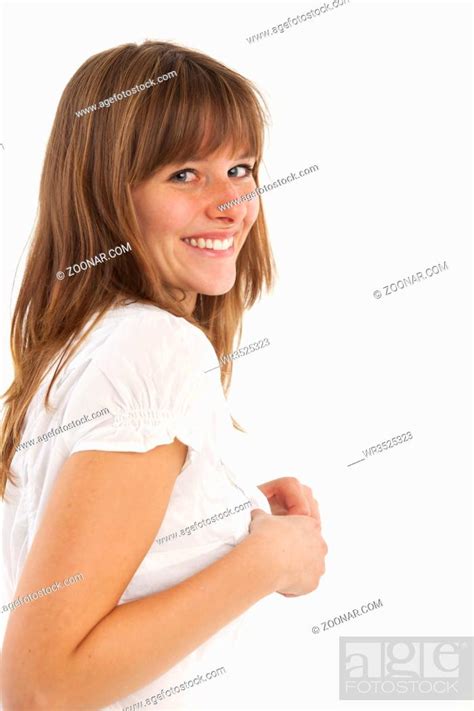 Frau zieht die Bluse aus, Stock Photo, Picture And Royalty Free Image