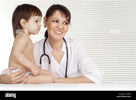 Female Doctor with child Stock Photo - Alamy