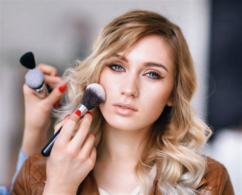 process  applying makeup   girls face stock photo image