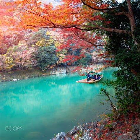 The katsura river - Boatman punting the boat for tourists to enjoy the