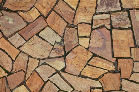 cobble marble stone paving mosaic texture background natural brown