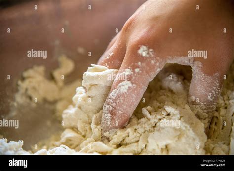 Hand kneading dough Stock Photo - Alamy