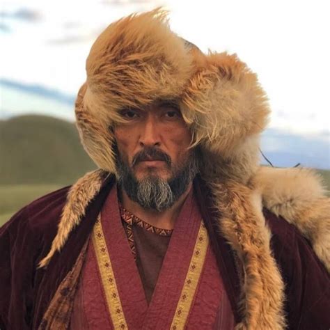 a man wearing a fur hat and coat
