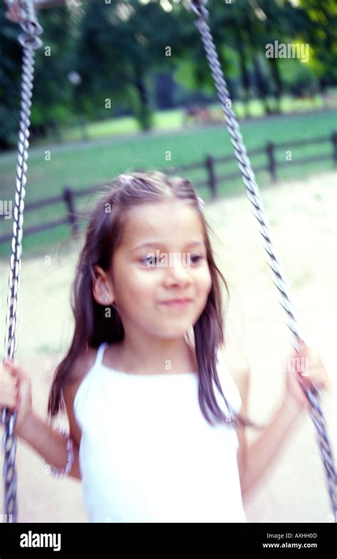 Playground swing girl sit hi-res stock photography and images - Alamy
