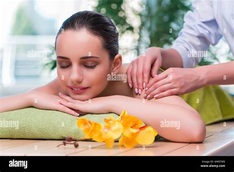 Young woman during massage session Stock Photo - Alamy