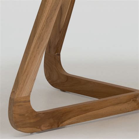 Table with Okumè top with microcement finish