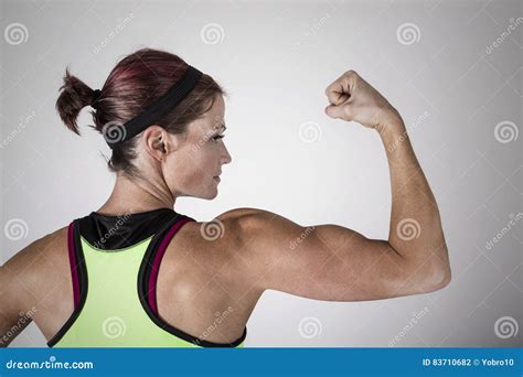 Woman Flexing Muscles Royalty-Free Stock Photo | CartoonDealer.com ...