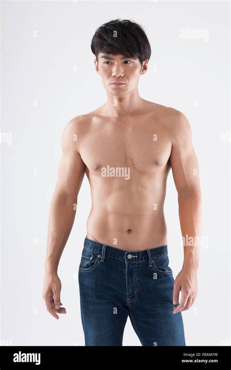 confident healthy asian man baring  upper body stock photo alamy