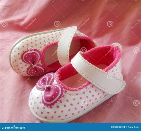 Cute Pink Baby Shoes for Little Girl on Pink Background Stock Photo ...