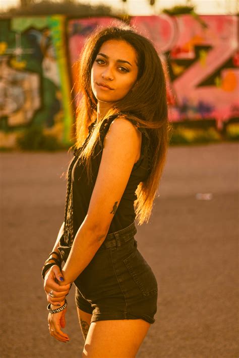 Download Spanish Woman In All-black Outfit Wallpaper | Wallpapers.com