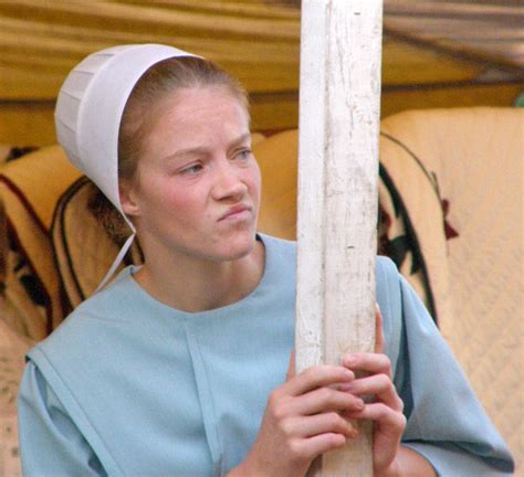 Captivating Portraits of Amish Women and Couples at Quilt Auction