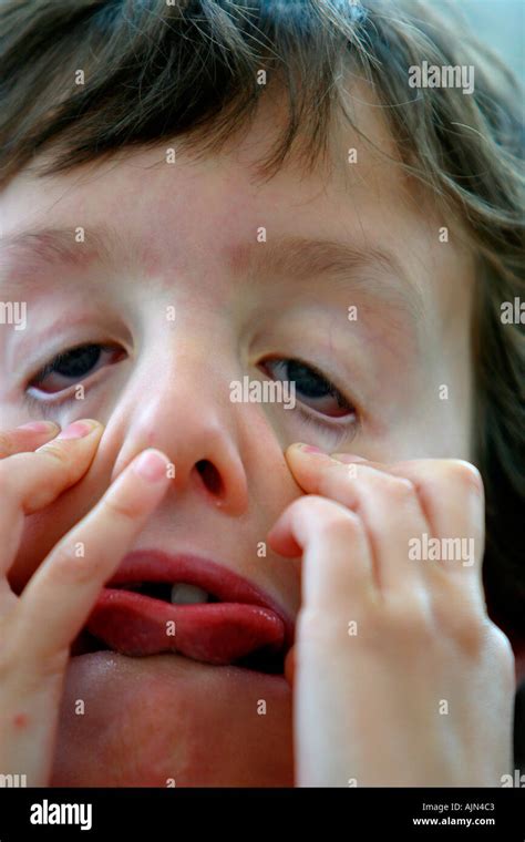 boy pulling  face stock photo alamy