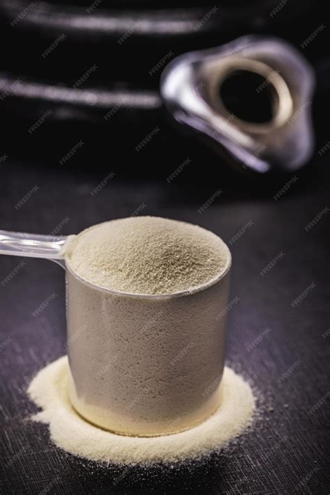 Premium Photo | Measuring spoon with creatine or whey food supplement