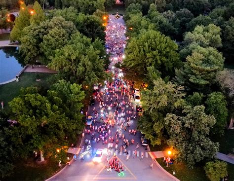 World Naked Bike Ride rolling through Tower Grove Park. Increasing
